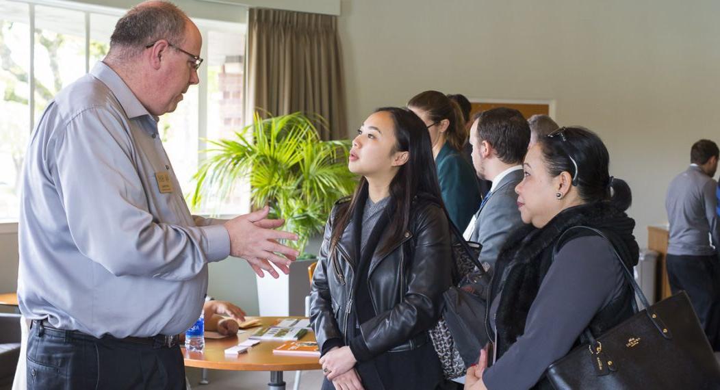 Prospective students meet with Financial Aid Director Joe Pinkas on the Sacramento campus.